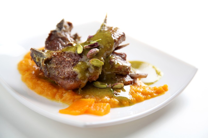 Lamb cutlets coated in Demetra pistachio sauce on creamed pumpkin