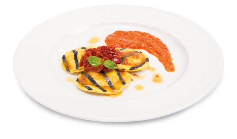 Codfish ravioli with peppers cream and dried tomato fillets