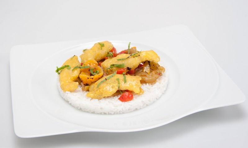 Chicken with wok curry sauce, rice and peppers