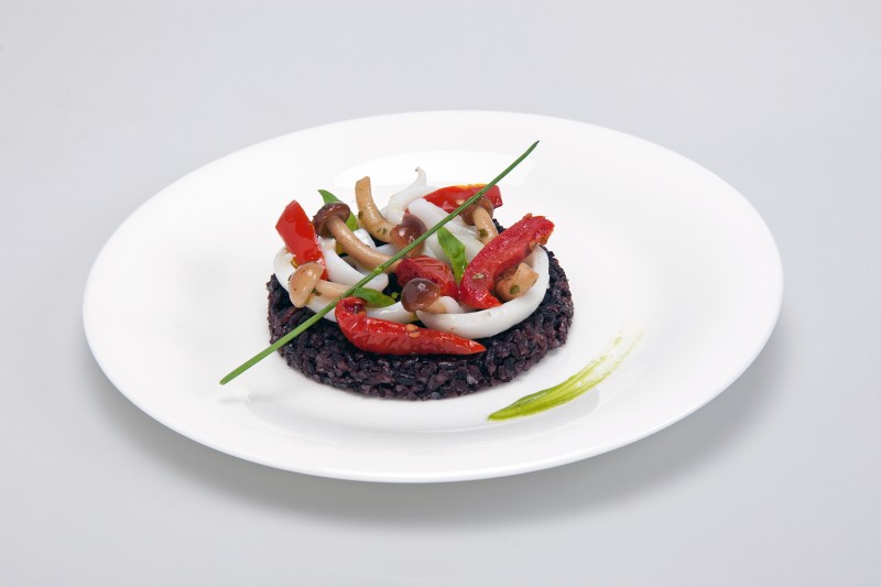 Black rice with poplar mushrooms, cuttlefish and tomatoes